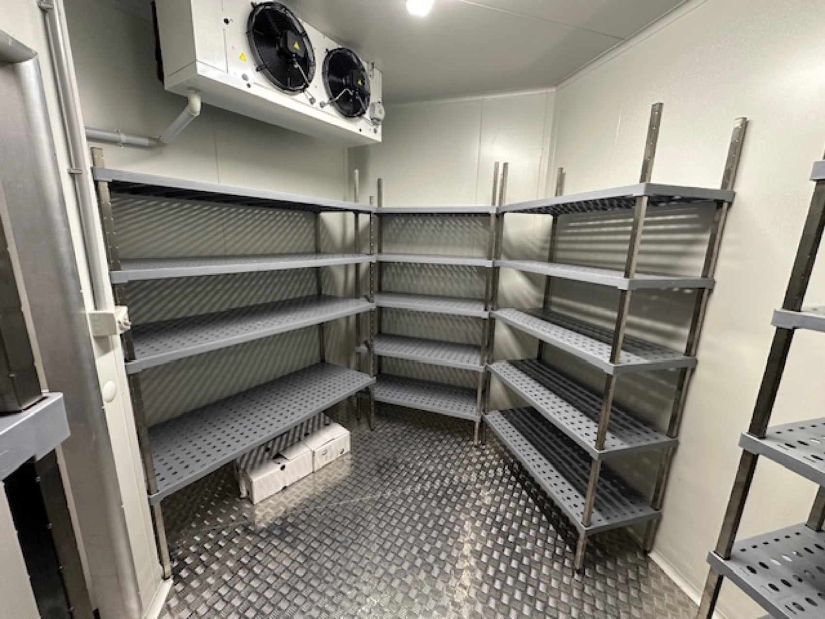 RHQ technician servicing refrigeration on site